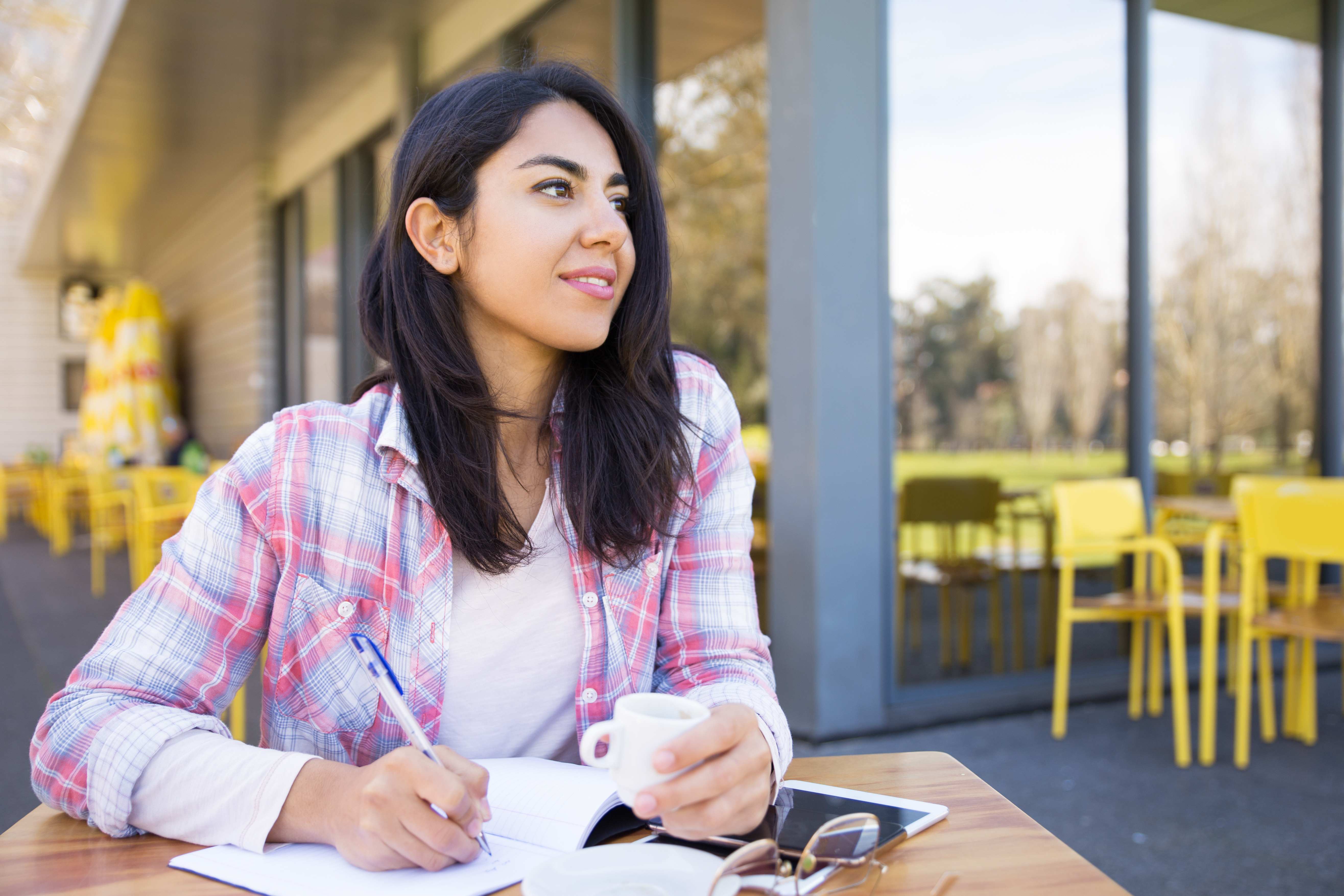 Student Working at Outdoor Cafe
